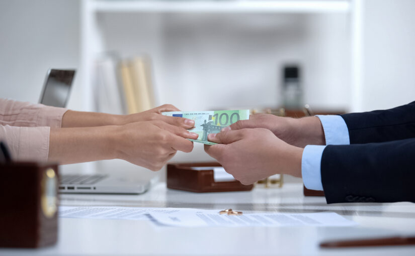 Man and woman hands pulling euro money, dividing marital propert